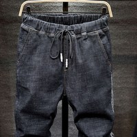 Dżinsy w dużym rozmiarze czarny mężczyzna plus rozmiar harem spodnie jesień elastyczne rozciągliwe dopasowanie stóp spodnie 7XL 6XL 5XL 3